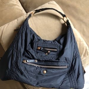 Tod’s Leather-Trimmed Nylon shoulder bag.